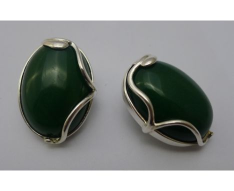 A pair of silver and jade clip earrings