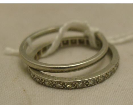 A platinum wedding band, size L, (1.9 grammes all in); together with an unmarked white metal diamond set eternity ring, size 