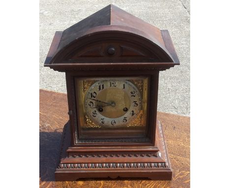 A late 19th century walnut mantle clock