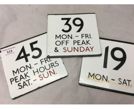 Three vintage enamel bus signs