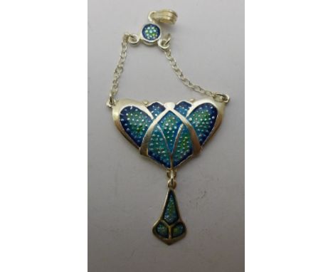 A small Art Nouveau style silver and enamel pendant
