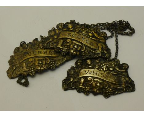 A set of three Georgian silver decanter labels for BOURBON, SCOTCH and WHISKEY