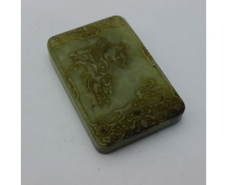 A jade tablet decorated with calligraphy