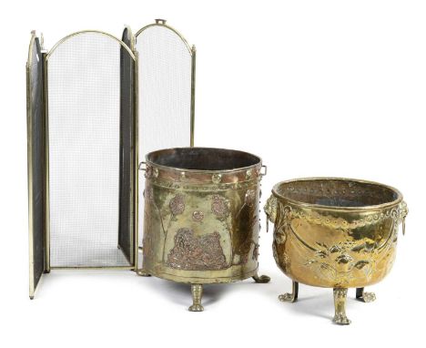 A DUTCH BRASS AND COPPER LOGBINLATE 19TH CENTURYdecorated with a recumbent lion and leaves on tripod supports, together with 