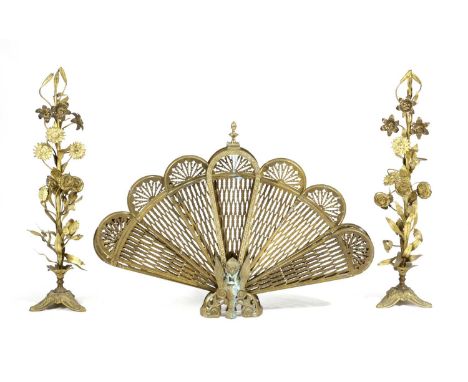 A FRENCH GILT BRASS FAN FIRESCREEN LATE 19TH CENTURYtogether with a pair of Victorian gilt brass fireside ornaments (3)77.3cm