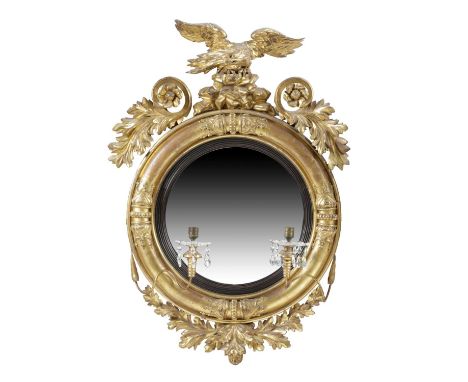 A LATE REGENCY GILTWOOD AND GESSO CONVEX GIRANDOLE MIRRORC.1820the circular plate within a reeded slip and a baton decorated 