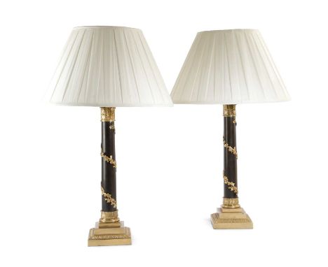 A PAIR OF GILT BRASS AND PATINATED TABLE LAMPSIN EMPIRE STYLE, 20TH CENTURYeach with a Corinthian capital above a grapevine w