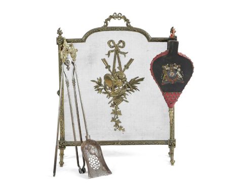 A FRENCH BRASS FIRESCREEN IN LOUIS XVI STYLE, LATE 19TH / EARLY 20TH CENTURYthe mesh guard decorated with trophies, together 