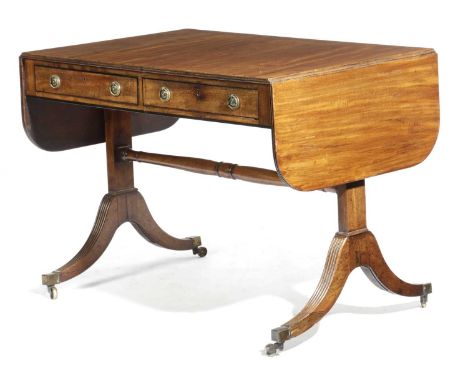 A REGENCY MAHOGANY SOFA TABLEEARLY 19TH CENTURYthe drop-leaf top with a reeded edge above a pair of frieze drawers, on trestl