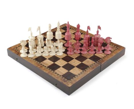 AN ENGLISH BONE BARLEYCORN PATTERN CHESS SET19TH CENTURYnatural and stained red, together with a folding games box, the exter