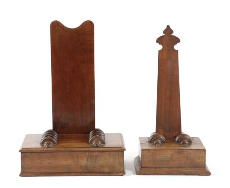 TWO GEORGE IV MAHOGANY CHARGER STANDSC.1825-30each with a shaped back above a rectangular plinth base with ribbed holders, on