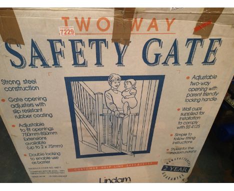 Boxed two way childs safety gate. Not available for in-house P&amp;P, contact Paul O'Hea at Mailboxes on 01925 659133 
