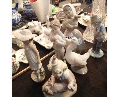 Six Nao figurines. Not available for in-house P&P, contact Paul O'Hea at Mailboxes on 01925 659133Condition Report: Clown mis