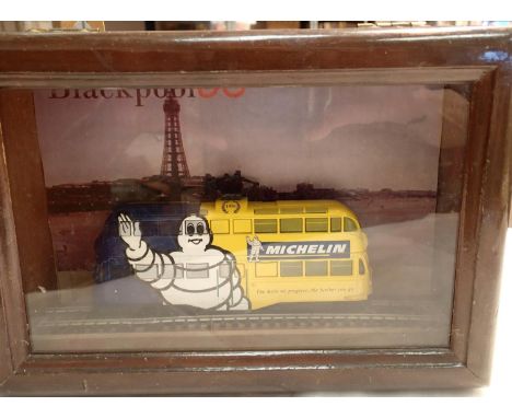 A Blackpool stationary Corgi  OO gauge tram carriage with a Michelin man in a wooden wall mounting display box. Not available
