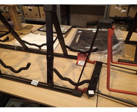 Stagg three place guitar stand and a Konig Meyer example. Not available for in-house P&amp;P, contact Paul O'Hea at Mailboxes
