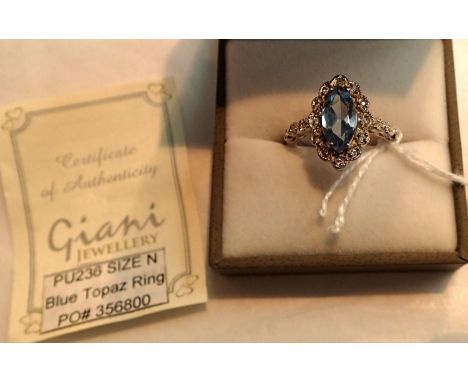Boxed blue topaz ring, size N. P&amp;P Group 1 (£14+VAT for the first lot and £1+VAT for subsequent lots) 