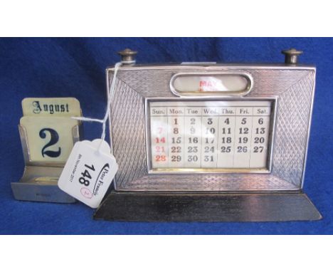 Engine turned silver mounted desk calendar with wooden back and base.  Birmingham hallmark 1931, together with another simple