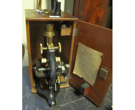 Lacquered brass and black enamel monocular microscope with three adjustable lenses, by W.R. Prior and Company of London, in o