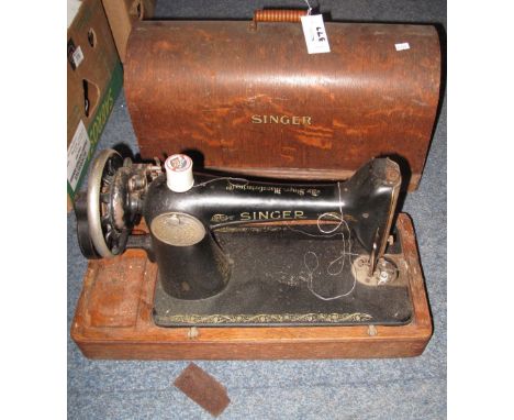 Two vintage Singer sewing machines in oak bentwood cases. (2)(B.P. 24% incl. VAT)