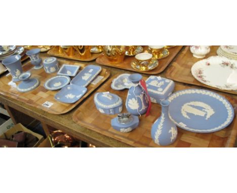 Two trays of Wedgwood blue and white Jasper ware items to include: trinket boxes; baluster vases; lighter; pin dish etc. (2)(