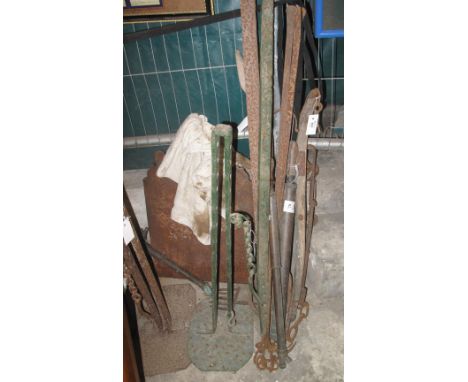 Collection of various cast iron and other implements to include: carriage jacks; vintage garden hose spray etc.(B.P. 24% incl