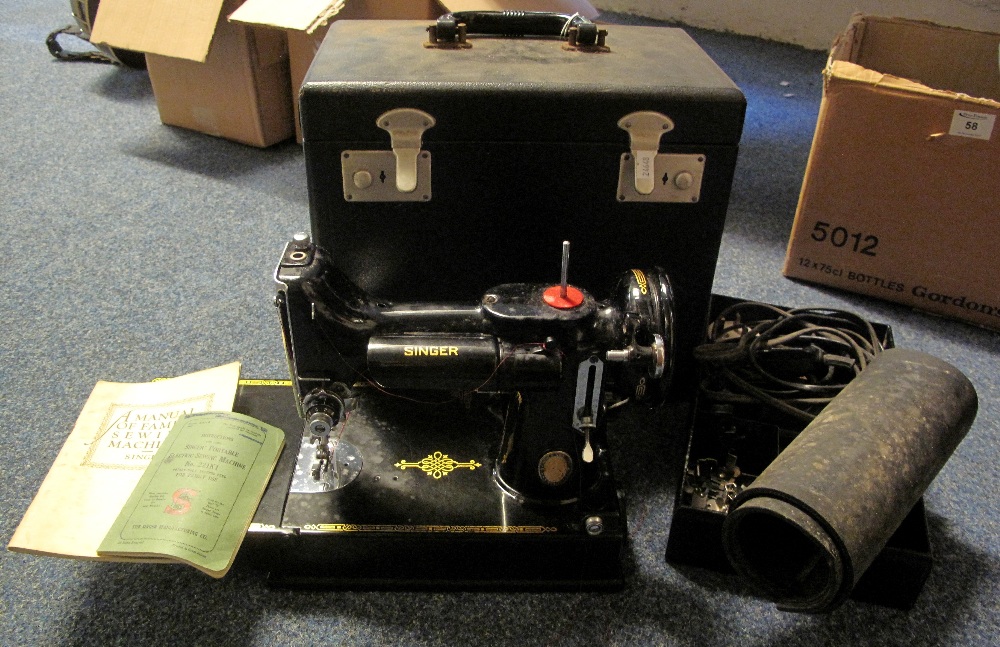 Singer portable electric sewing machine, number 221K1, in original box