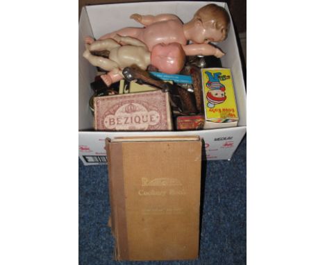 Box of assorted items to include: plastic dolls; card games and playing cards; Art Nouveau silver plated pill box; souvenir s