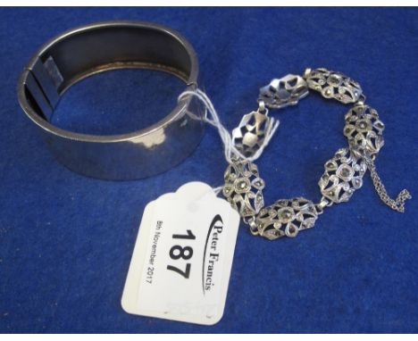 Silver hinged bangle with engraved bird decoration inset with gold bands, together with a silver marquisette bracelet.(B.P. 2