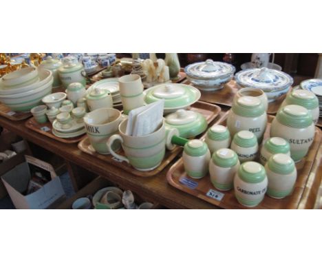 Seven trays of T.G. Green kitchenalia items on a cream and green banded ground, comprising: labelled canisters including: 'pe