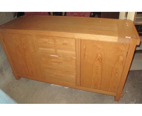 Modern solid light oak sideboard with an arrangement of drawers and cupboards.(B.P. 24% incl. VAT)