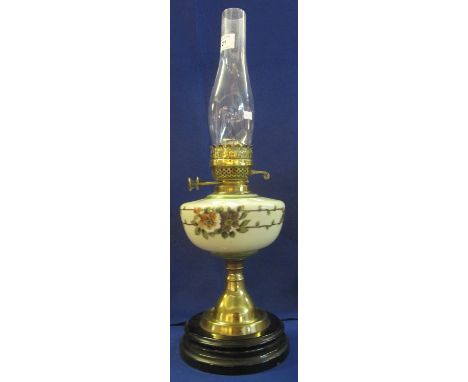 Early 20th Century brass double burner oil lamp with painted glass reservoir on brass pedestal with ceramic base.  Clear glas