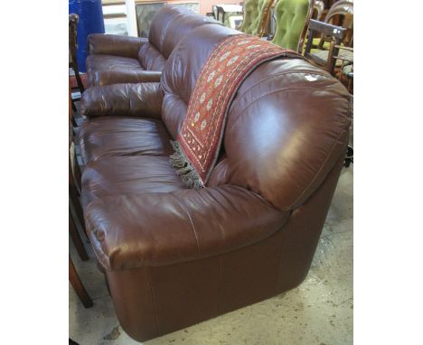 Modern brown leather two seater sofa.(B.P. 24% incl. VAT)