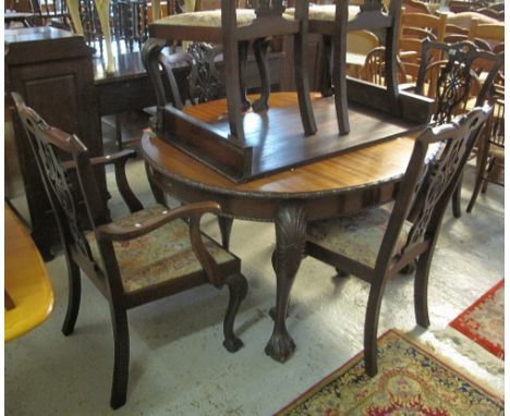 Mahogany Chippendale style dining room suite comprising oval extending dining table, set of six chairs (4+2) and a bow front,