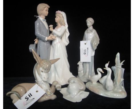 A group of Spanish porcelain figures and figurines to include wedding couple, country boy, Lladro cherub head, Lladro recumbe