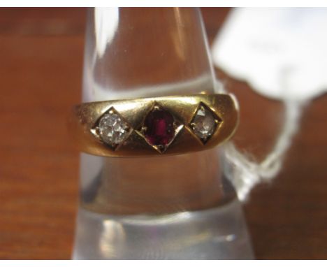 18ct gold diamond and ruby three stone dress ring.(B.P. 24% incl. VAT)   CONDITION REPORT:  Weight 6 grams.