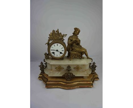 French Gilt Metal and Alabaster Mantel Clock, circa 19th century, Decorated with a Scholar next to the Clock, Having a Twin T