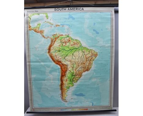 A ROLLER WALL MAP OF SOUTH AMERICA by "Westermann Maps", printed paper, laid on fabric, with two ebonised wooden rollers, 148