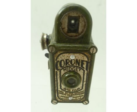 A CORONET MIDGET CAMERA in green mottled Bakelite case, takes 16mm film, 6cm high 