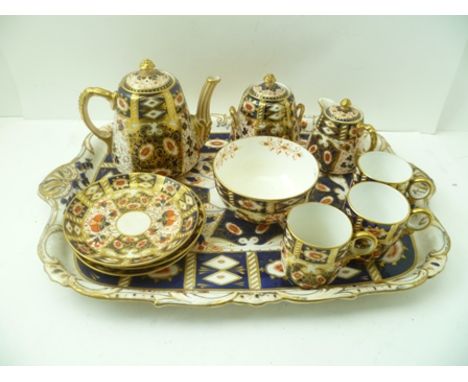 A DAVENPORT CERAMIC TEASET gilded and decorated in the Imari palette, comprising teapot, milk jug, sugar bowl, slop bowl, fou