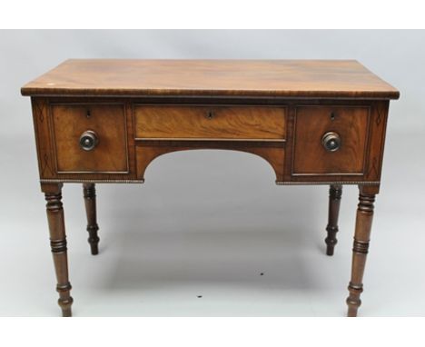 A 19TH CENTURY MAHOGANY SIDE TABLE, with ebony inlay and bead edging, fitted central frieze drawer over an arch, the flanking