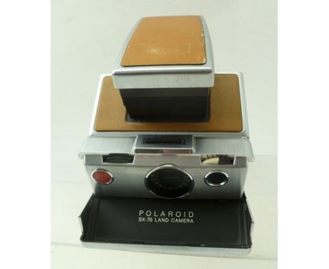 A POLAROID SX-70 LAND CAMERA 