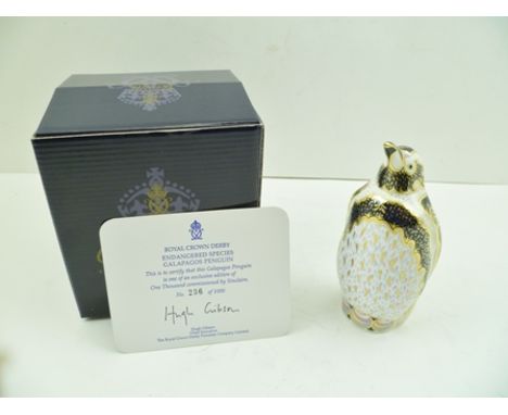 A ROYAL CROWN DERBY BONE CHINA IMARI PAPERWEIGHT, Galapagos Penguin, limited edition no.236 of 1000, in original box, with ce