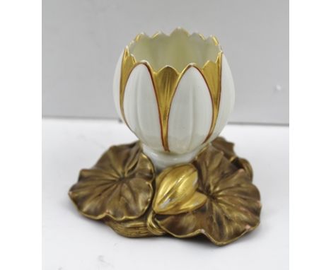 A ROYAL WORCESTER POSY VASE, a lotus flower on a bed of leaves, gilt decorated on an ivory ground, marks to base, dated 1883,