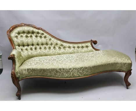 A LATE VICTORIAN CARVED MAHOGANY SINGLE END SHOW-WOOD FRAMED CHAISE LONGUE, having serpentine seat, upholstered in self patte