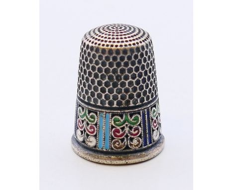 A silver and enamel thimble bearing Russian marks.  2.25 cm high. 