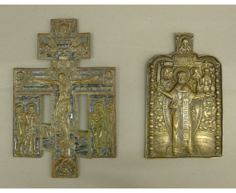 An 18th/19th century Russian travelling icon, the bronze and blue enamel image depicting Christ on the cross surrounded by sa