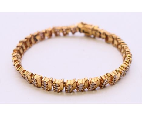 A 9 K gold bracelet set with diamonds. 10.3 grammes total weight.  15.5 cm long. 