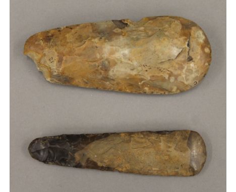 Two Stone Age flint hand tools. The largest 18 cm long.
