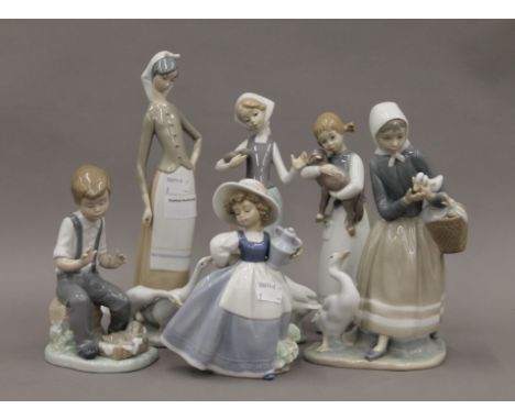 Four Lladro figurines and two Nao figurines. The largest 27.5 cm high.