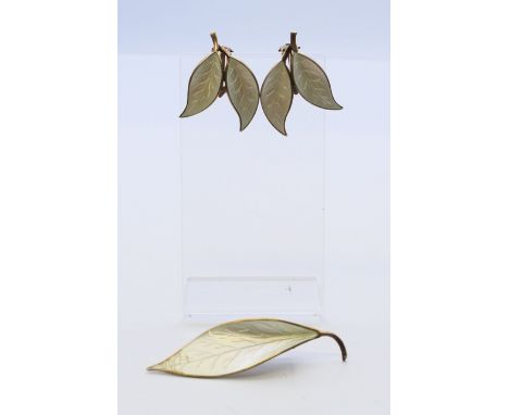 A David Andersen silver and white enamel leaf brooch and a pair of matching double leaf clip-on earrings.  Brooch 6.5 cm long